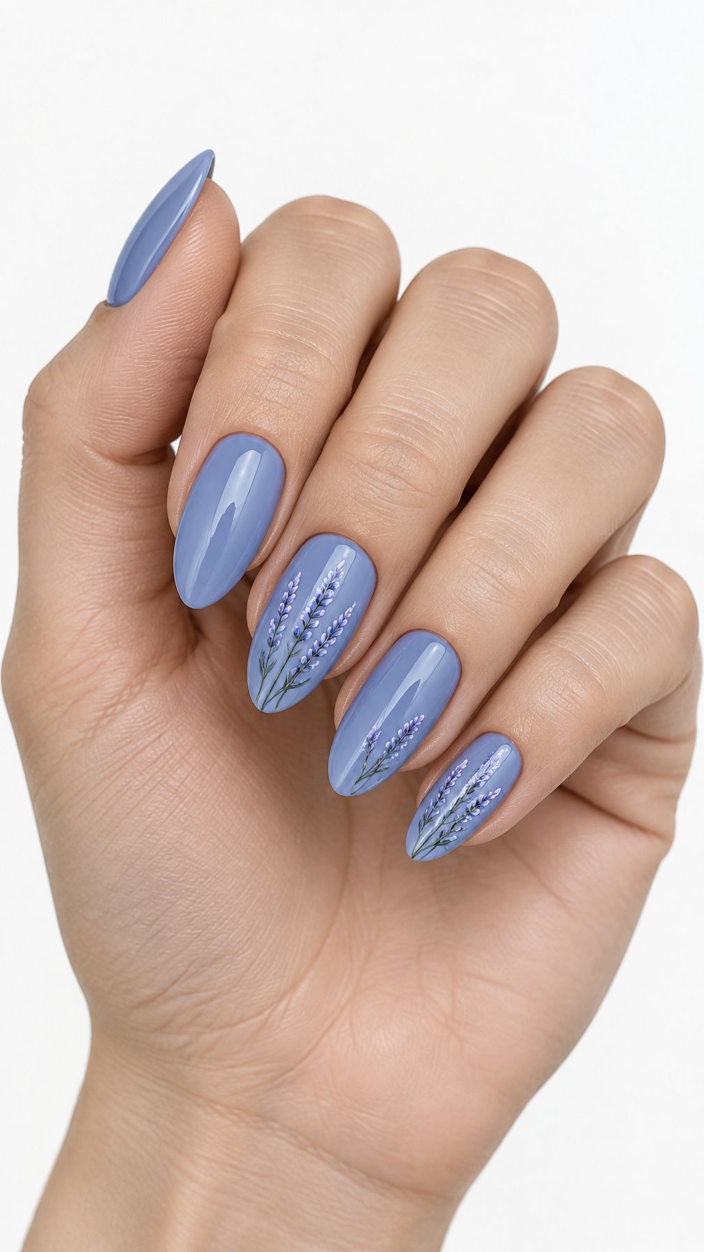 One hand with dusty blue nails decorated with delicate lavender sprigs against a white background.