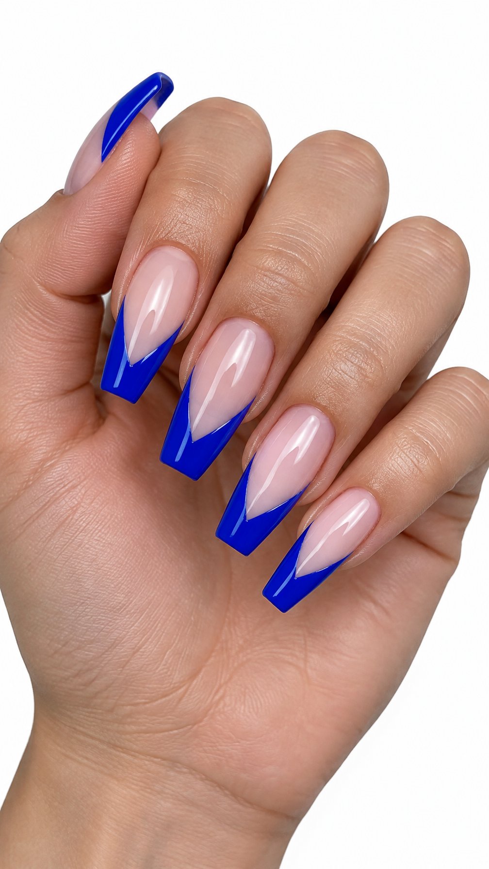 A single hand displays five coffin-shaped nails with bright blue V-shaped French tips against a white background.