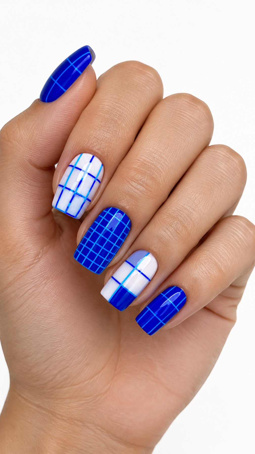 One hand with glossy electric blue geometric grid nail art against a white background.