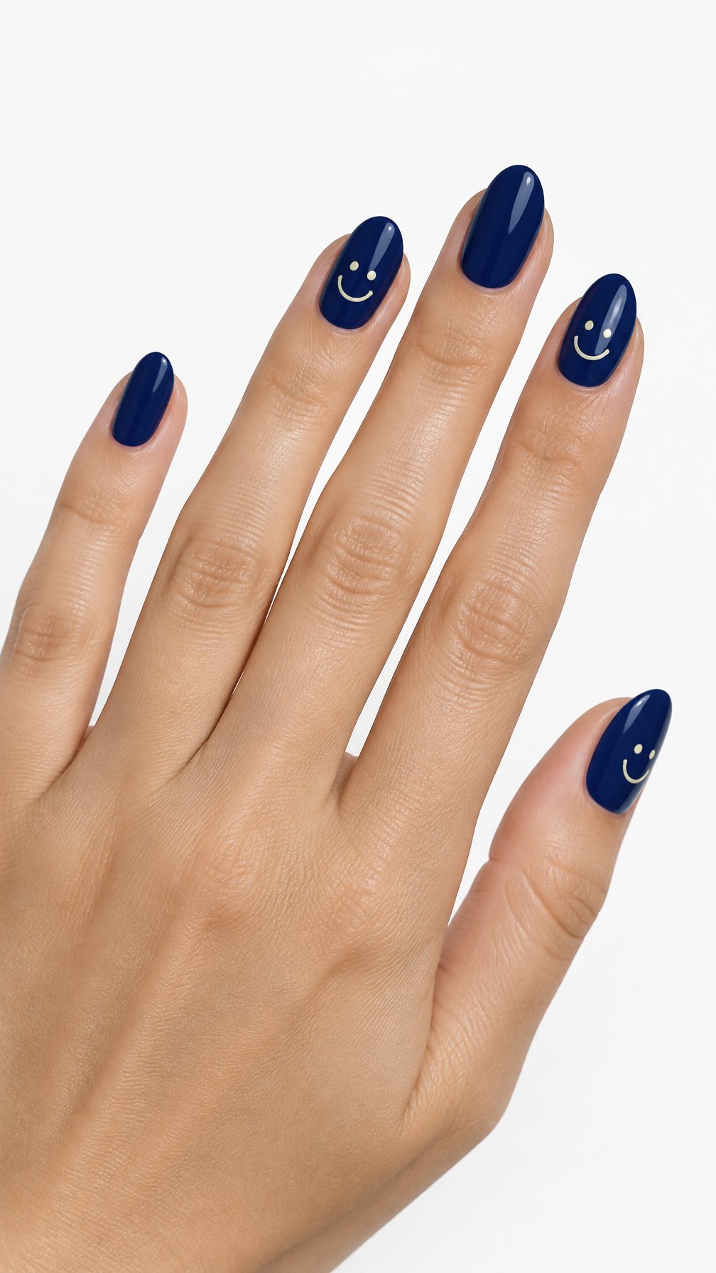 A single hand with glossy midnight blue nails and small smiling face designs on several accent nails against a white background.