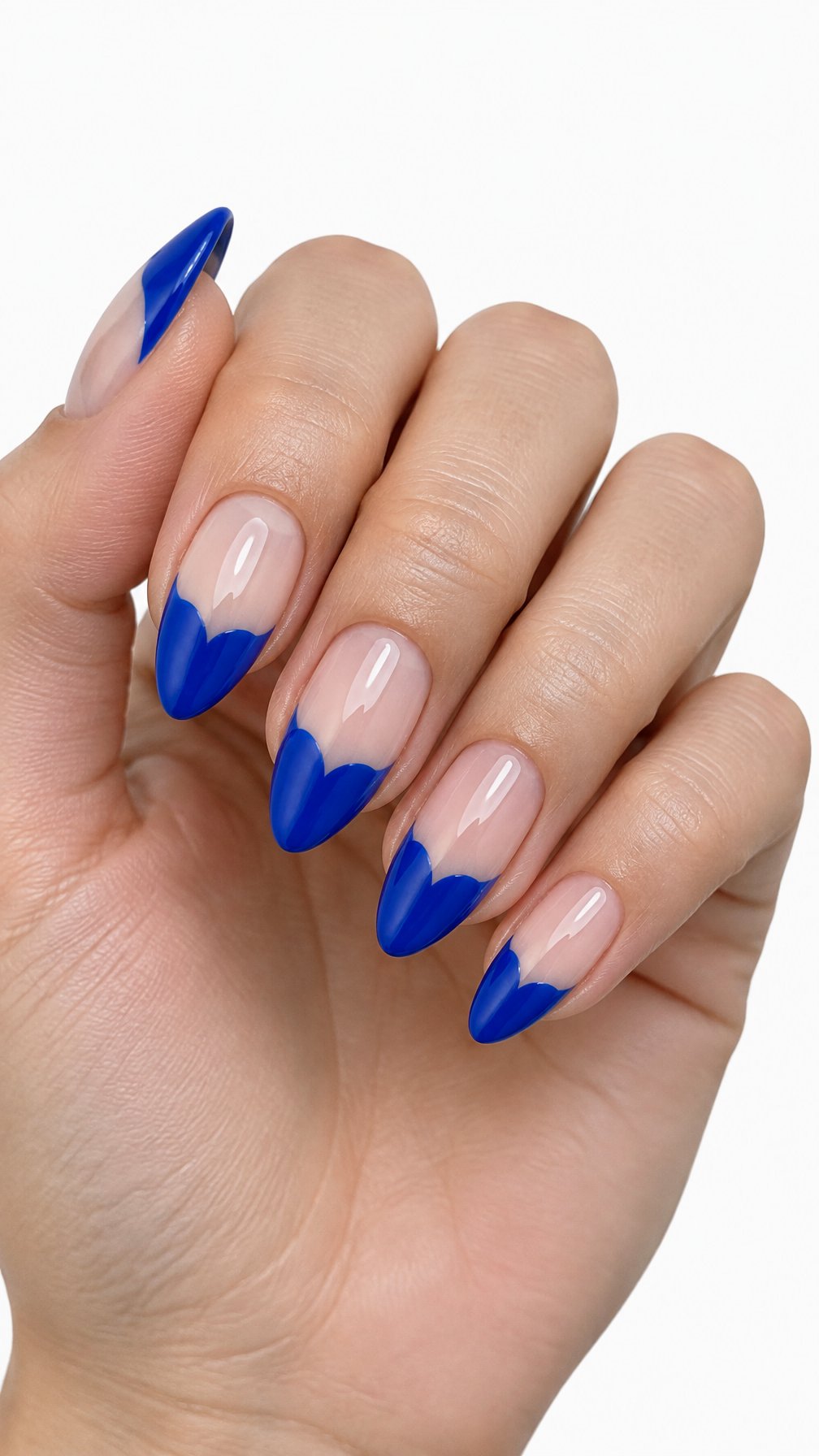 A single hand with glossy cobalt blue heart-tip manicure against a white background.