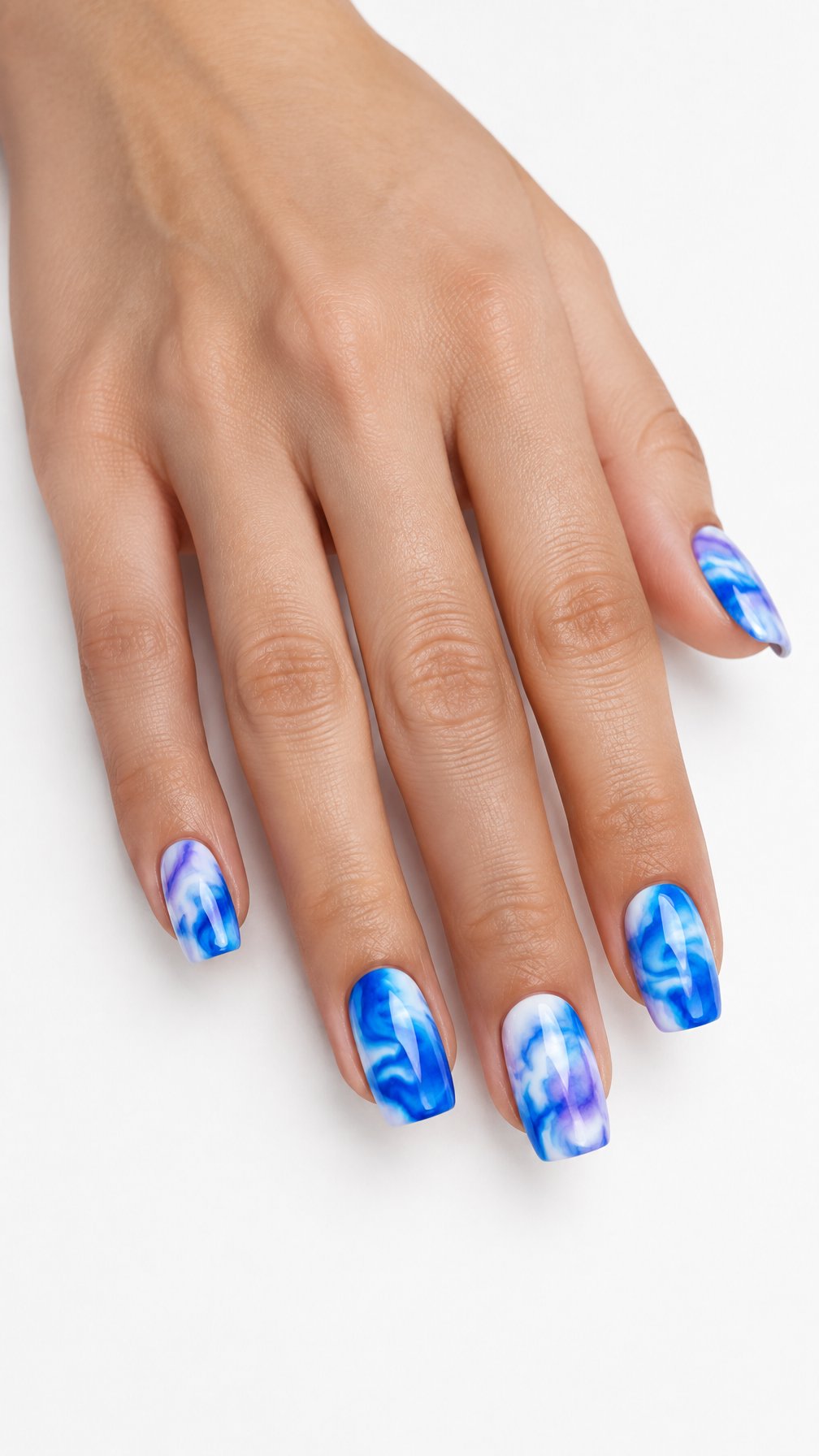 A single hand with glossy electric blue, purple, and white tie-dye painted nails against a white background.