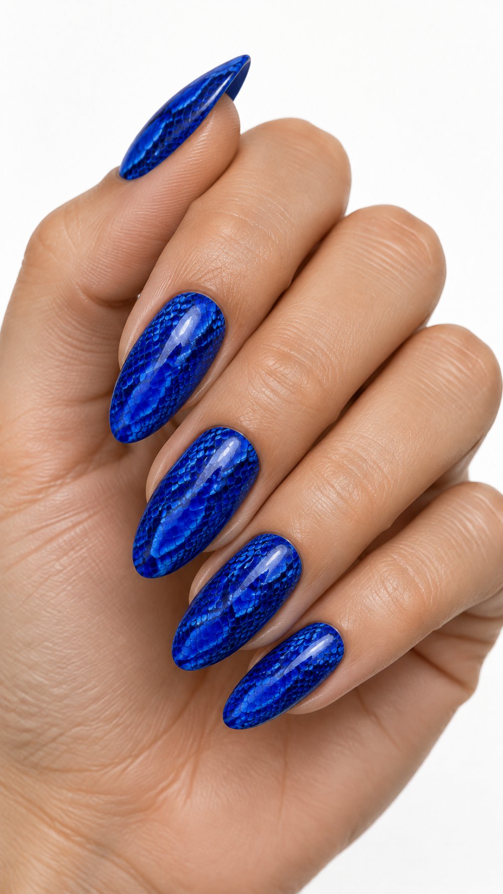 A single hand with glossy electric blue nails decorated with detailed snake-print patterns against a white background.
