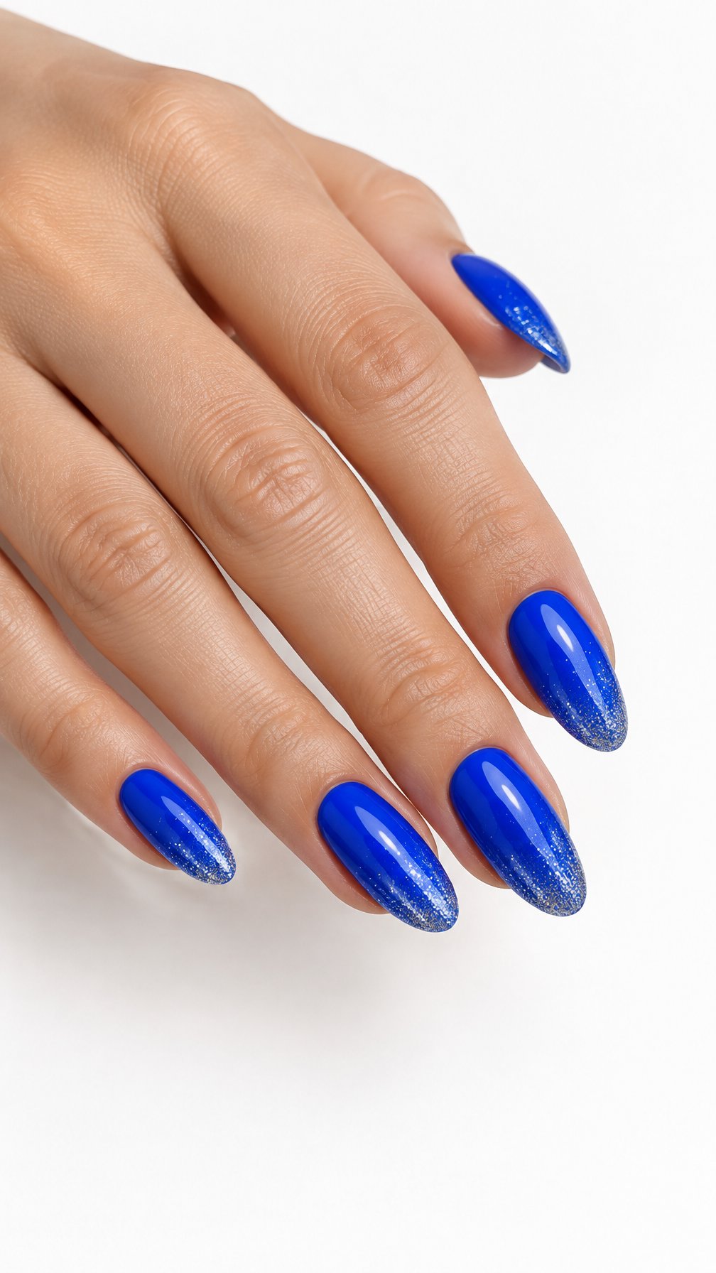 A single hand with glossy electric blue nails accented by fine silver glitter rests against a white background.