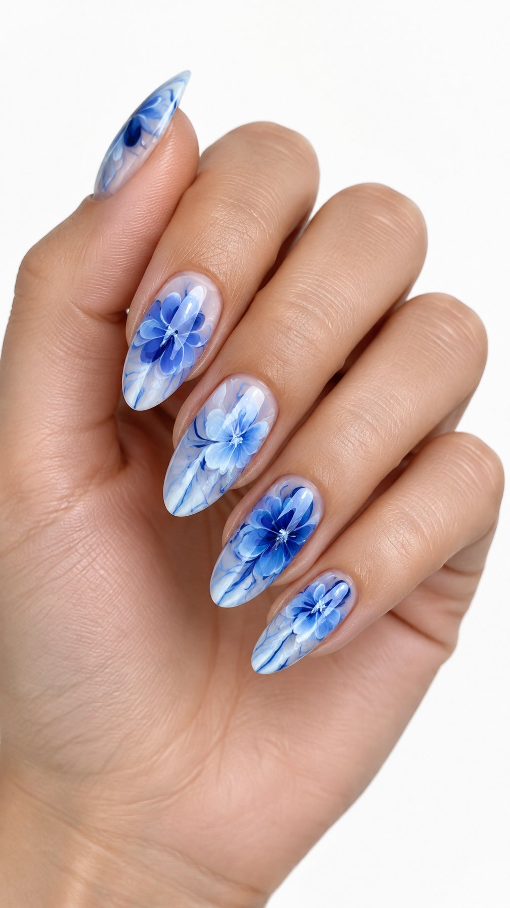 A single hand with glossy blue and white floral-patterned nails against a white background.