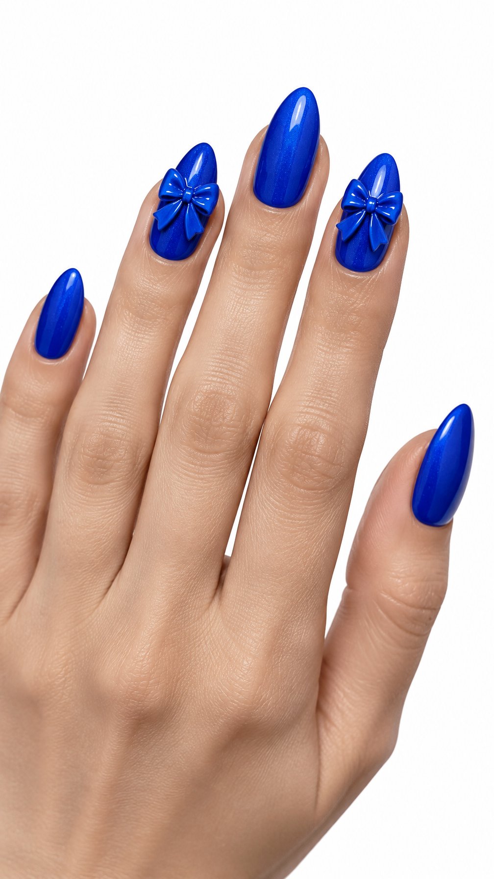 A single hand with glossy cobalt blue nails and raised blue bow designs on accent nails against a white background.