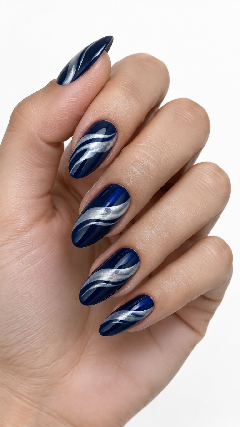 A single hand with glossy midnight blue nails decorated with pearlized white wave patterns on a white background.