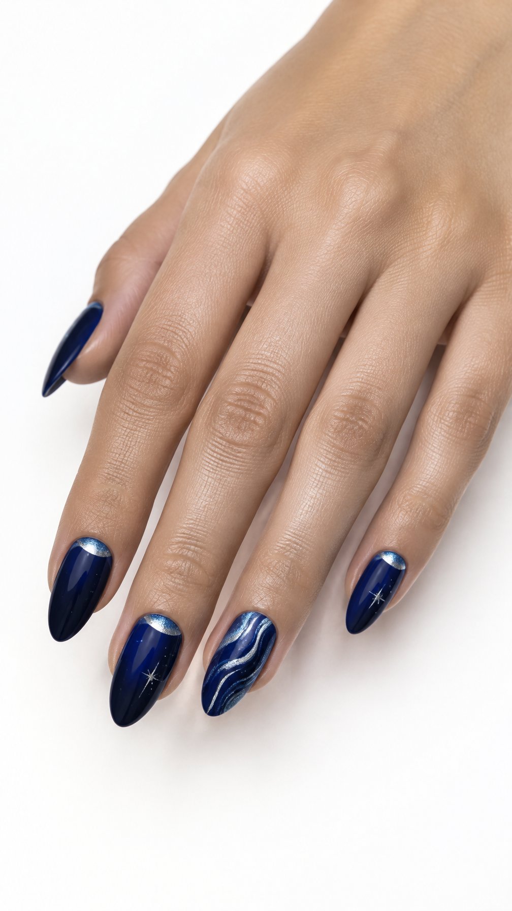 A single hand with glossy midnight blue almond-shaped nails featuring delicate silver-blue accents on a white background.