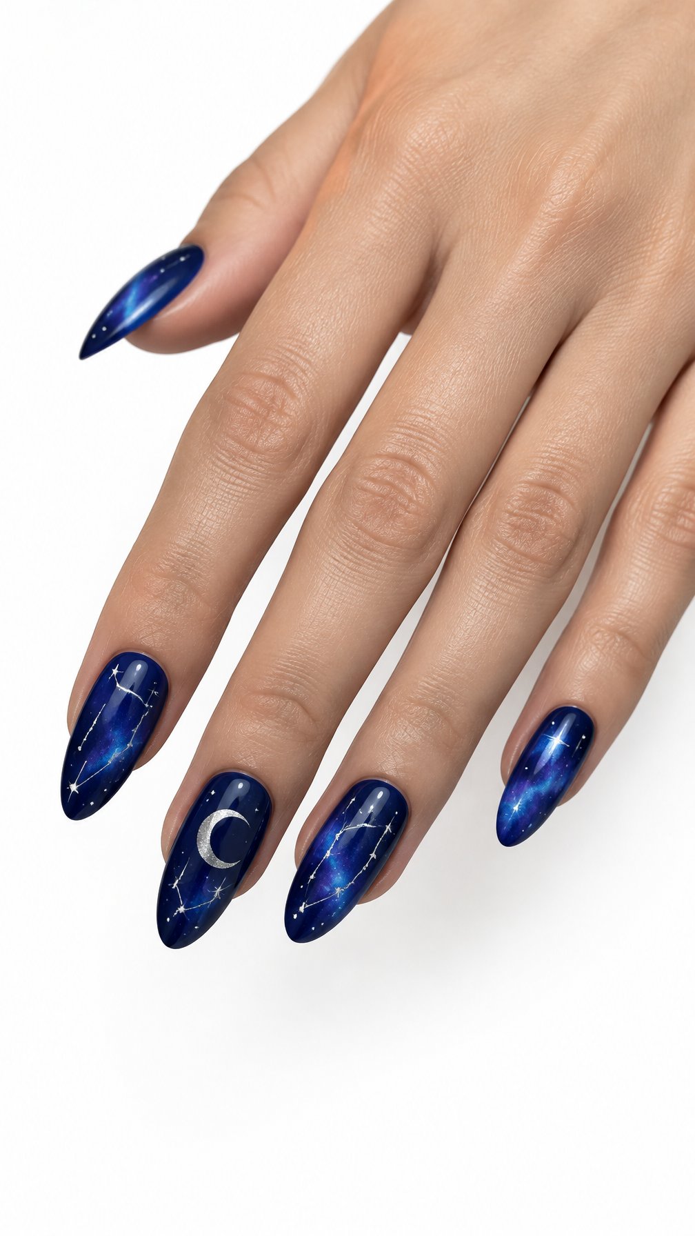 A single hand with glossy deep blue nails decorated with tiny stars and constellation patterns on a white background.