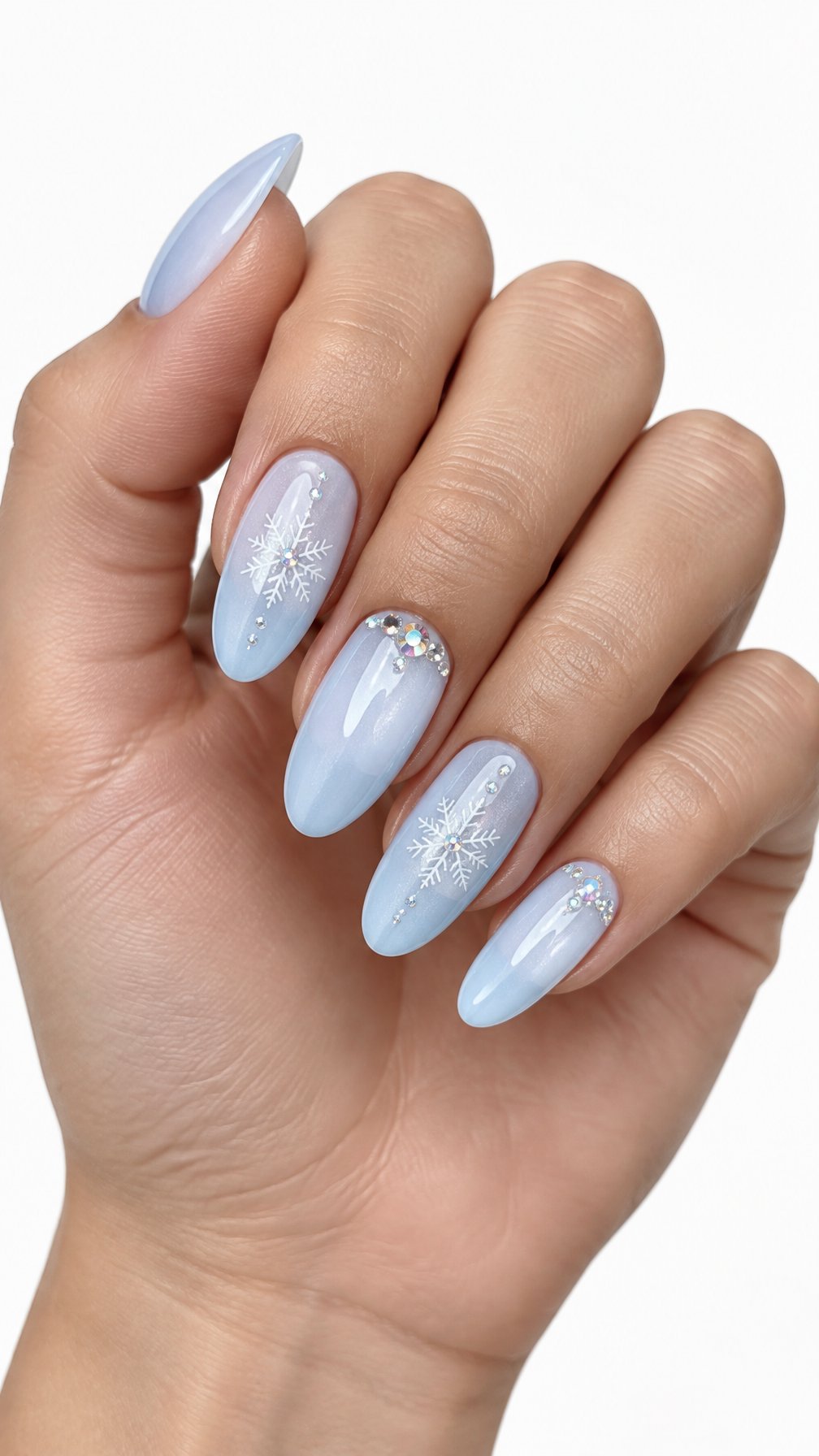 A single hand with glossy icy blue nails decorated with white snowflakes and small sparkling crystals on a white background.