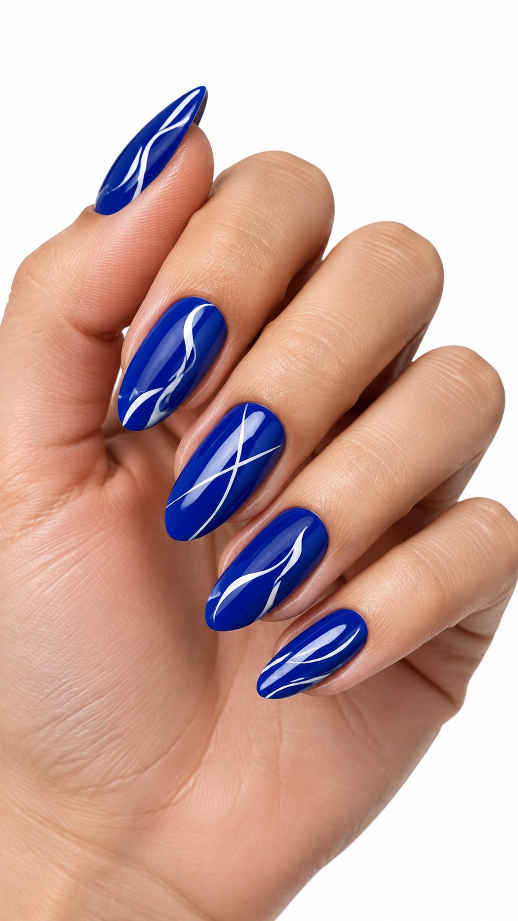 A single hand with glossy royal blue nails decorated with white abstract lines against a white background.
