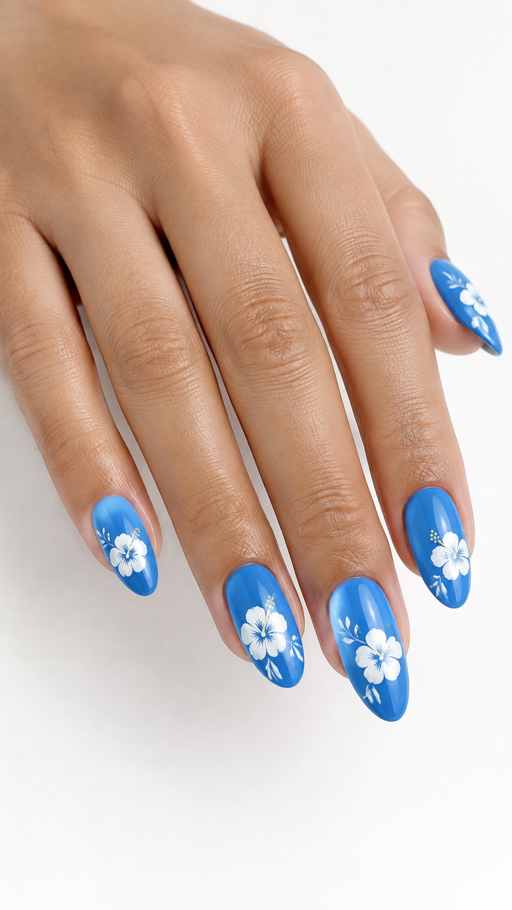 A single hand with glossy cerulean blue nails decorated with delicate white hibiscus flowers against a white background.