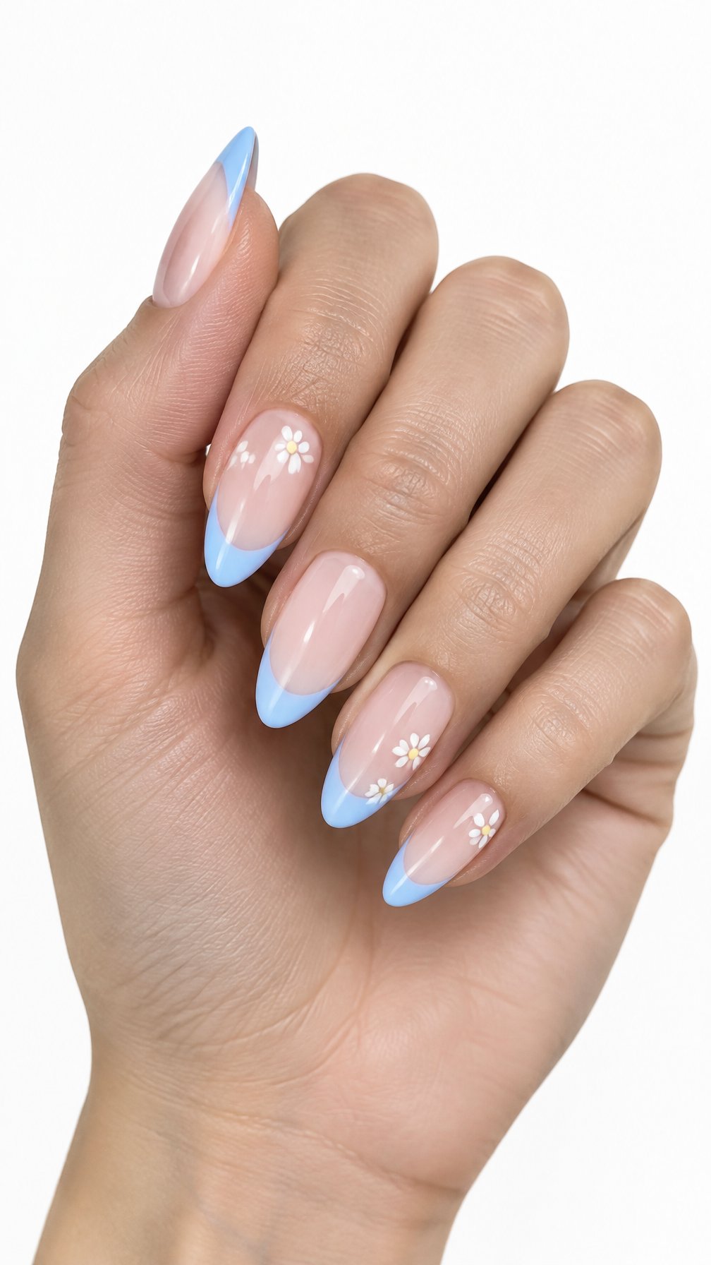 A single hand with almond-shaped nails featuring sky-blue French tips and tiny white daisies on a white background.