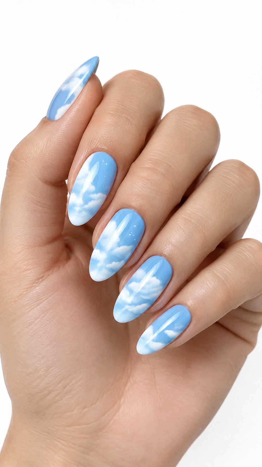 A single hand with powder blue almond-shaped nails decorated with white cloud designs against a white background.