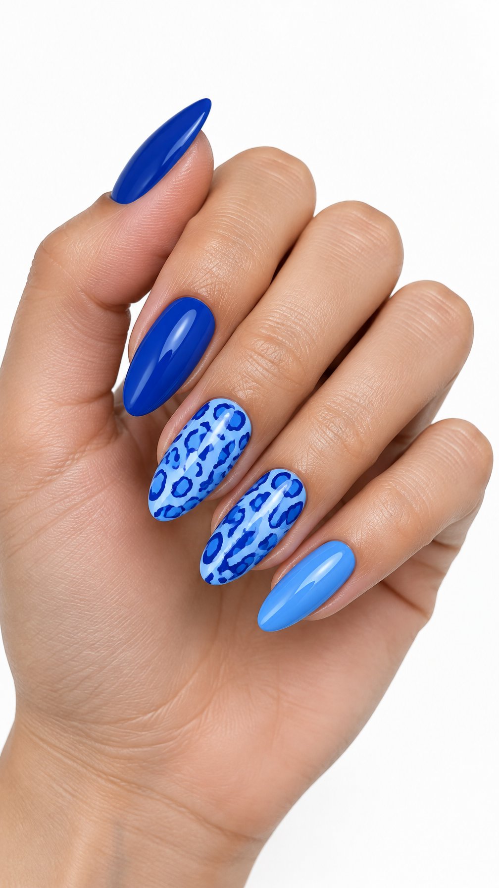 A single hand displays glossy blue almond-shaped nails, including accent nails with blue leopard print designs, against a white background.