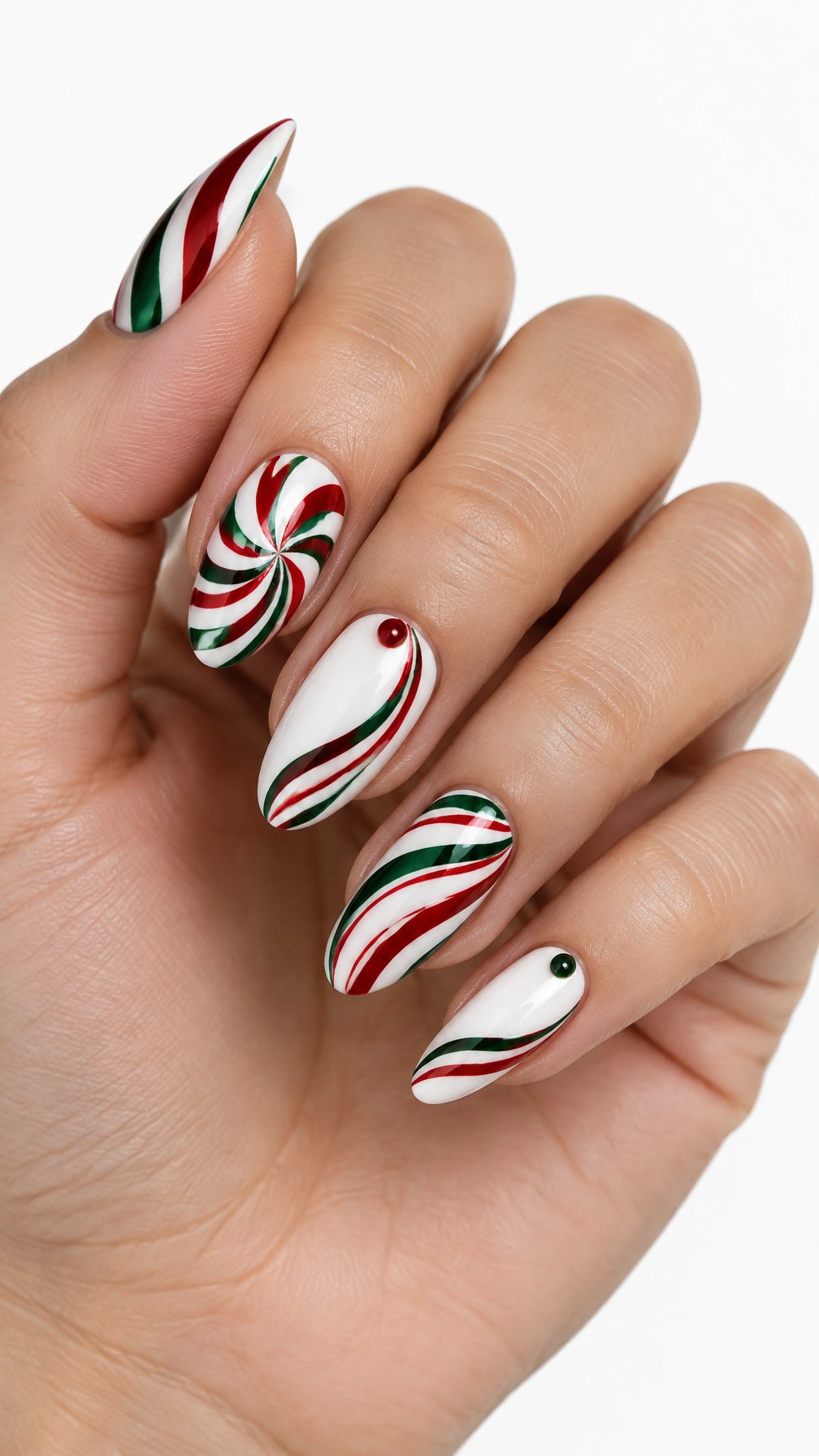 A single hand with glossy red, green, and white peppermint swirl nail art on a white background.