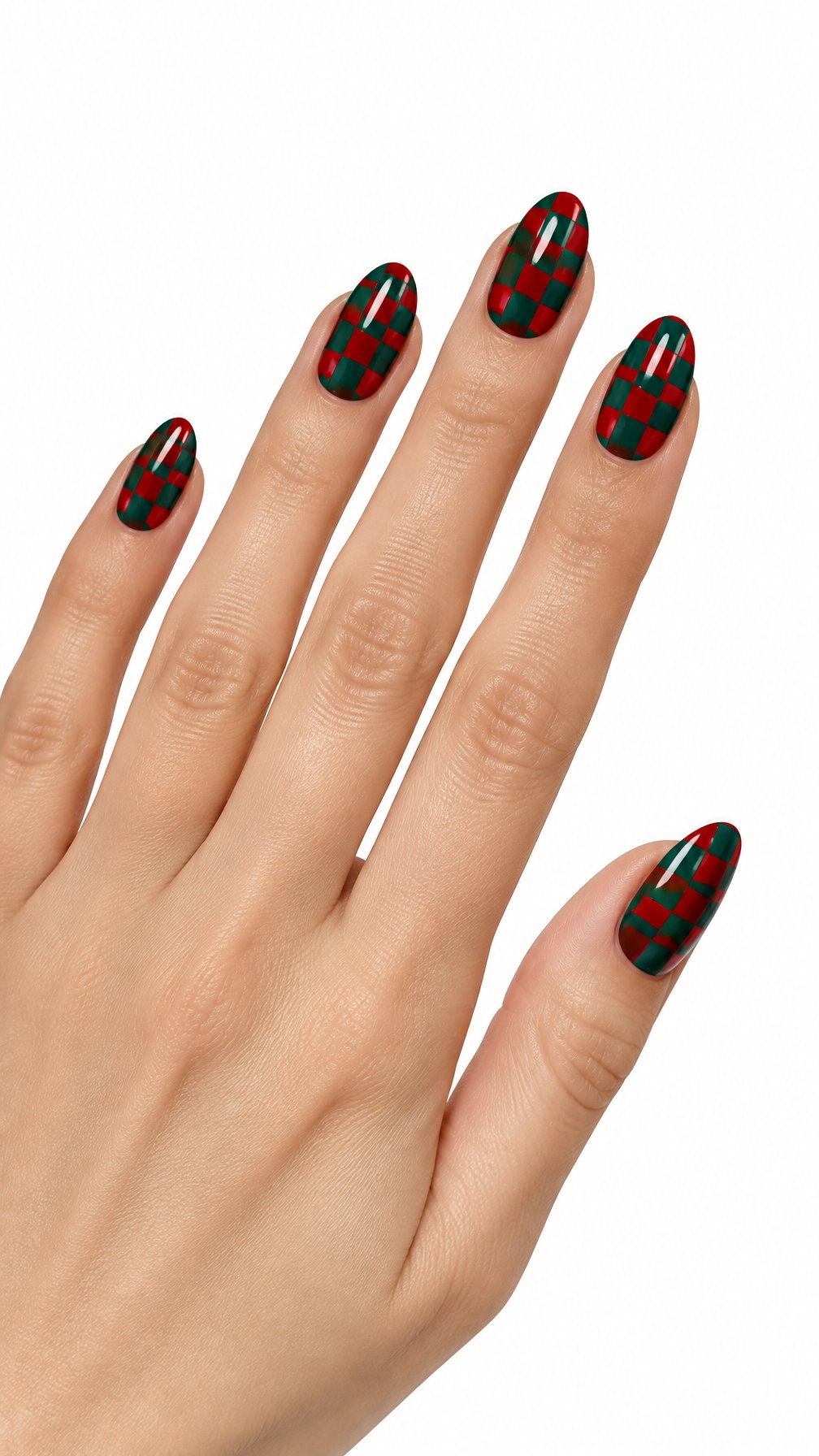 A single hand with glossy red-and-green checkerboard Christmas nail art against a white background.