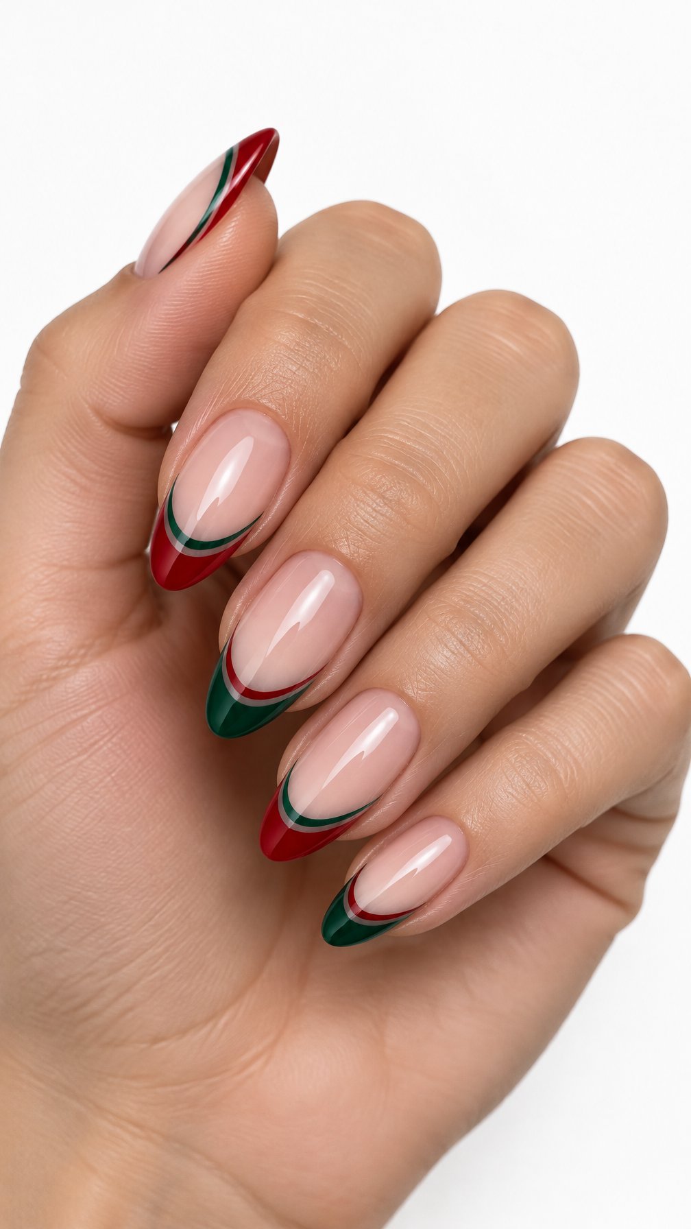 One hand with red and green layered French tip nails against a white background.