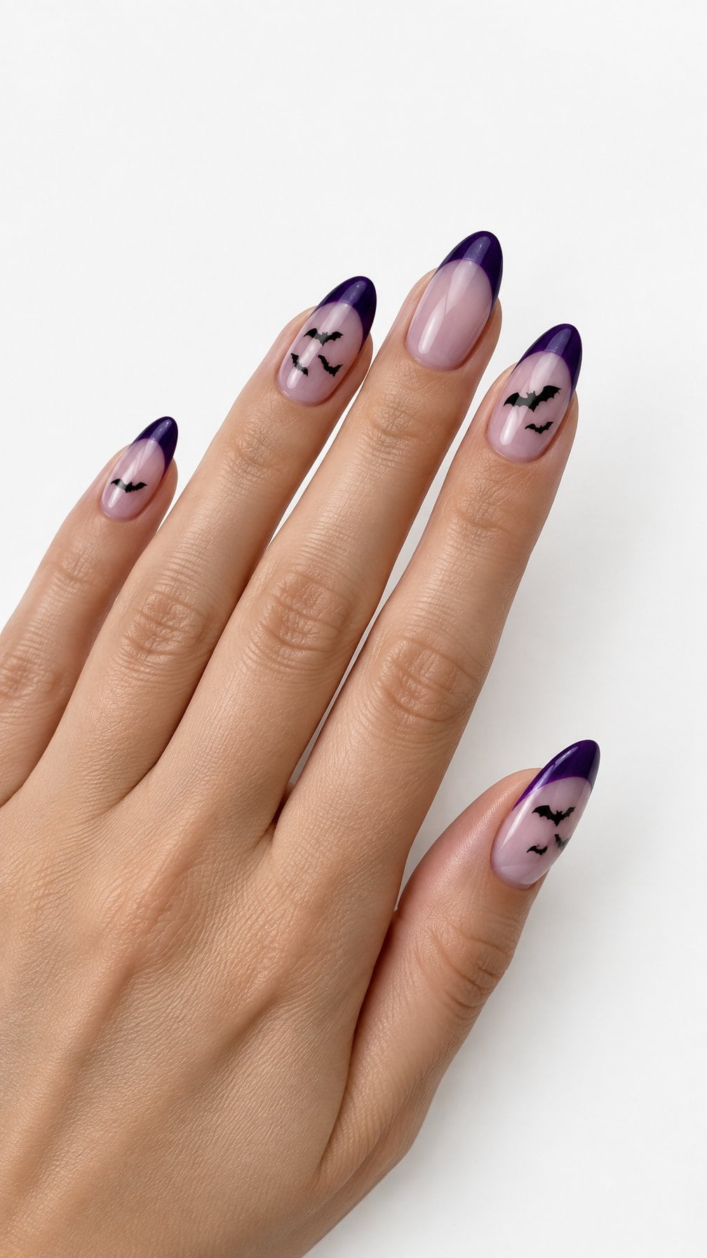 Glossy purple French manicure tips and small black bat designs
