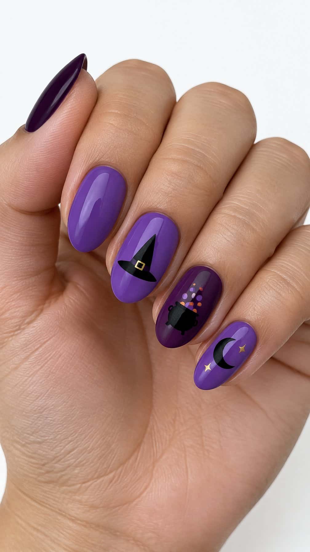 Glossy purple Halloween gel nails featuring witch hats, cauldrons, stars, and solid-color nails